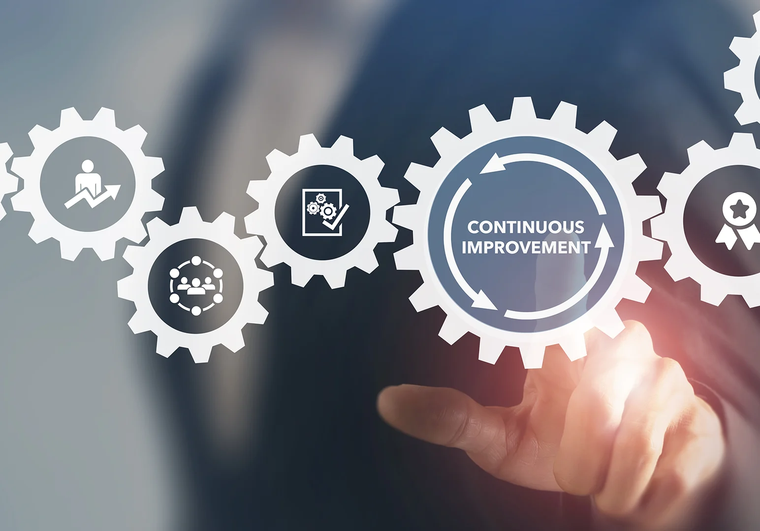 A person is holding a hand with gears